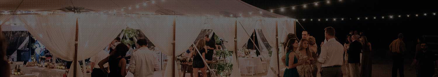 Reception under a tent with café lights