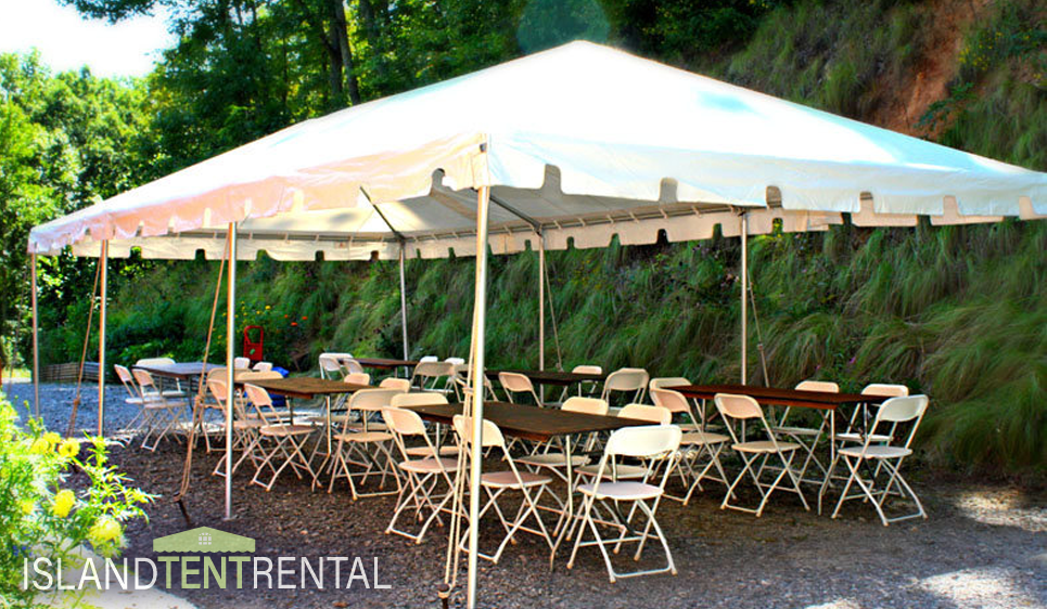 15 by 30 tent set with chairs in a yard